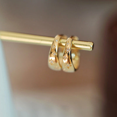 Boucles d’oreilles luxueuses en or et en argent